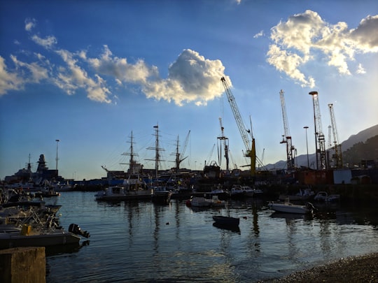 boats on sea under blue sky and white clouds during daytime in Porto Di Salerno Italy