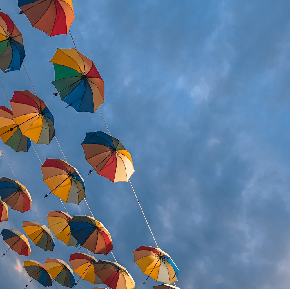 multi colored umbrella under blue sky during daytime