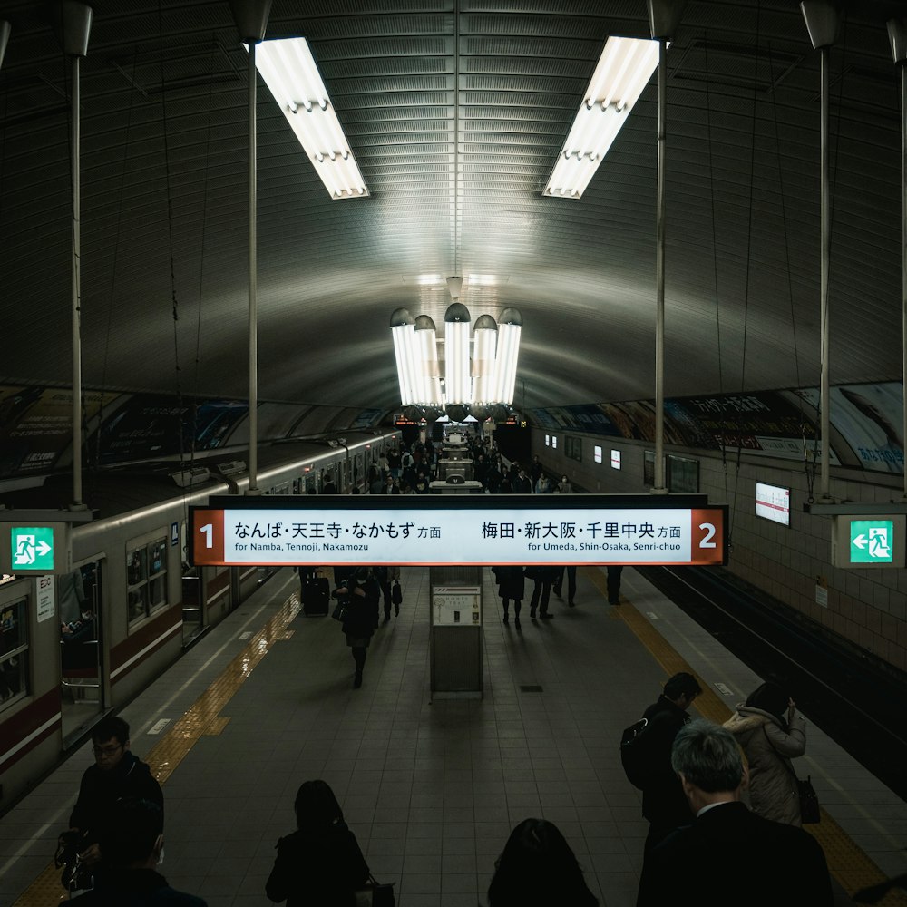 people walking on train station