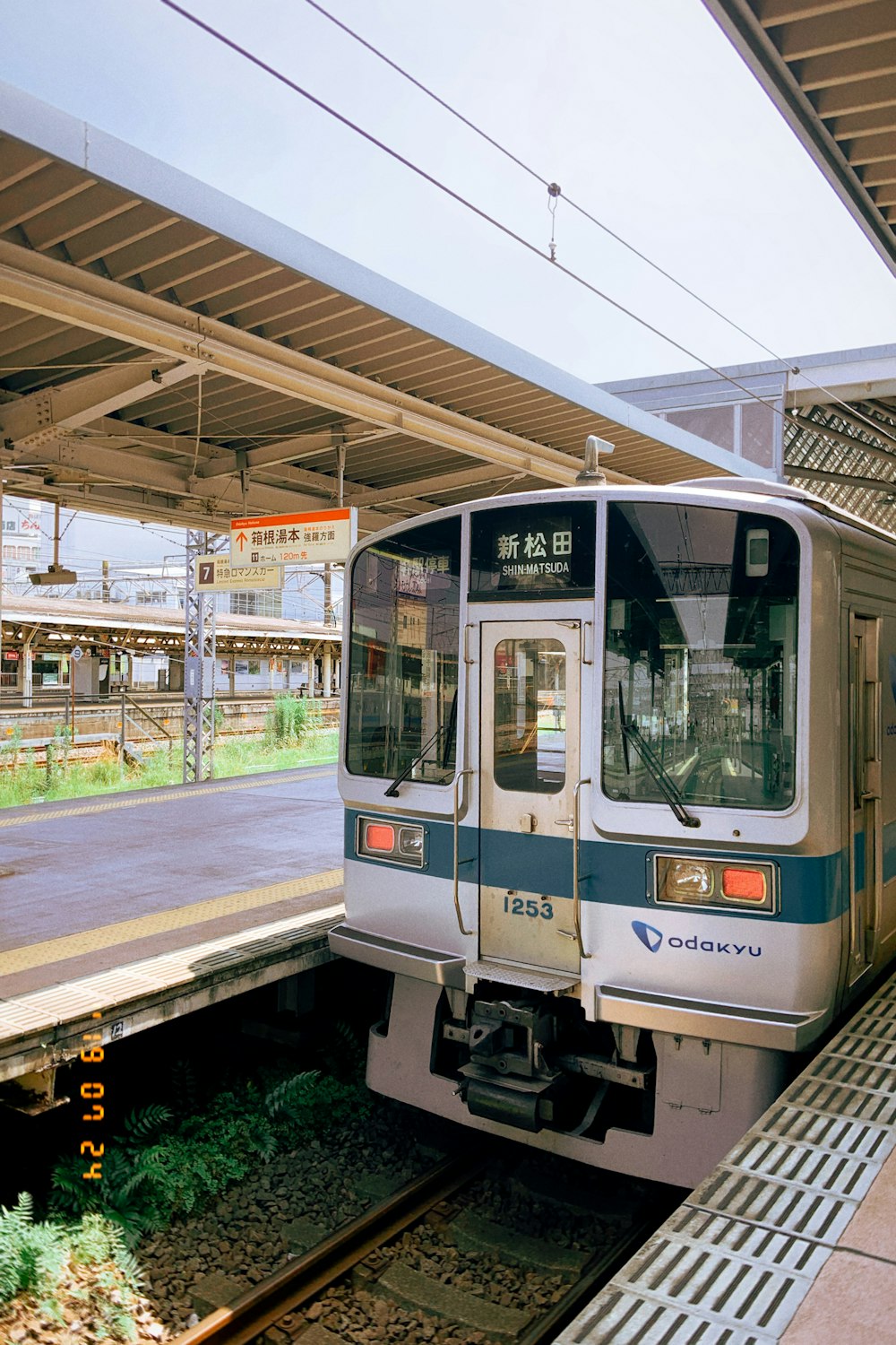 white and green train on rail during daytime