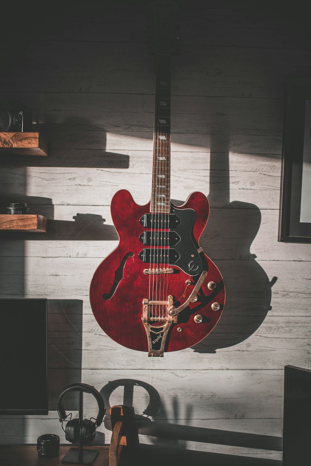 red and brown electric guitar