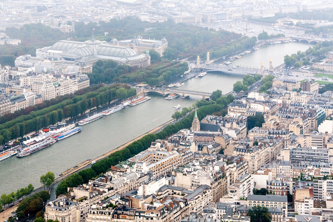 aerial view of city buildings near body of water during daytime