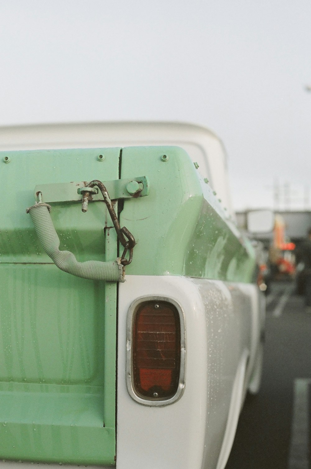 green and white car on road during daytime