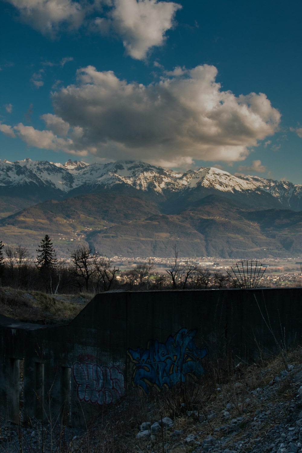 brown wooden fence near brown mountains under blue sky during daytime