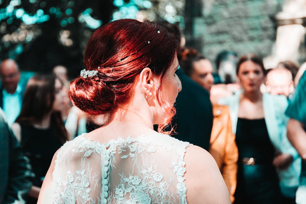 woman in white floral lace wedding dress