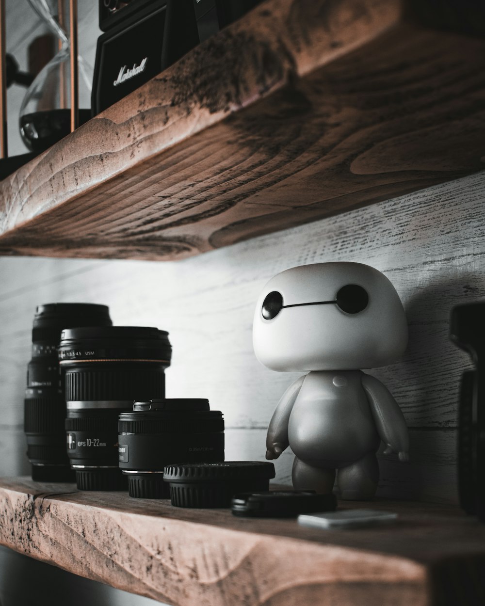 black dslr camera on brown wooden table