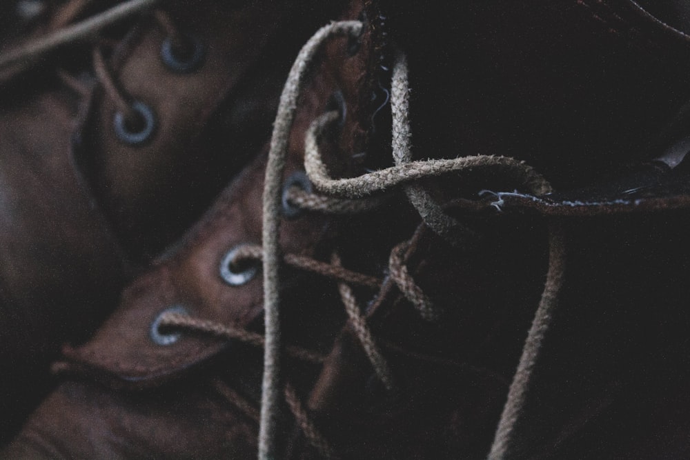 brown and white rope on brown textile