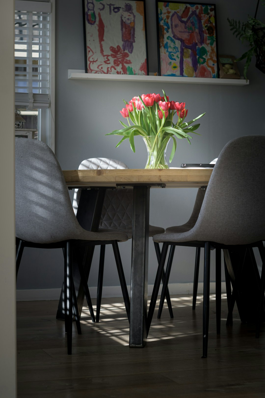 red and yellow flowers on white wooden table