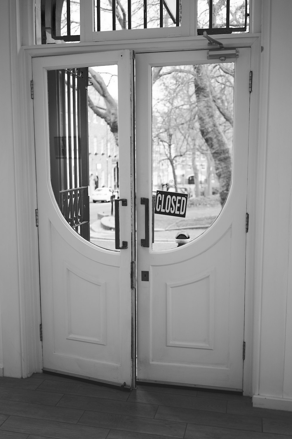 grayscale photo of glass window