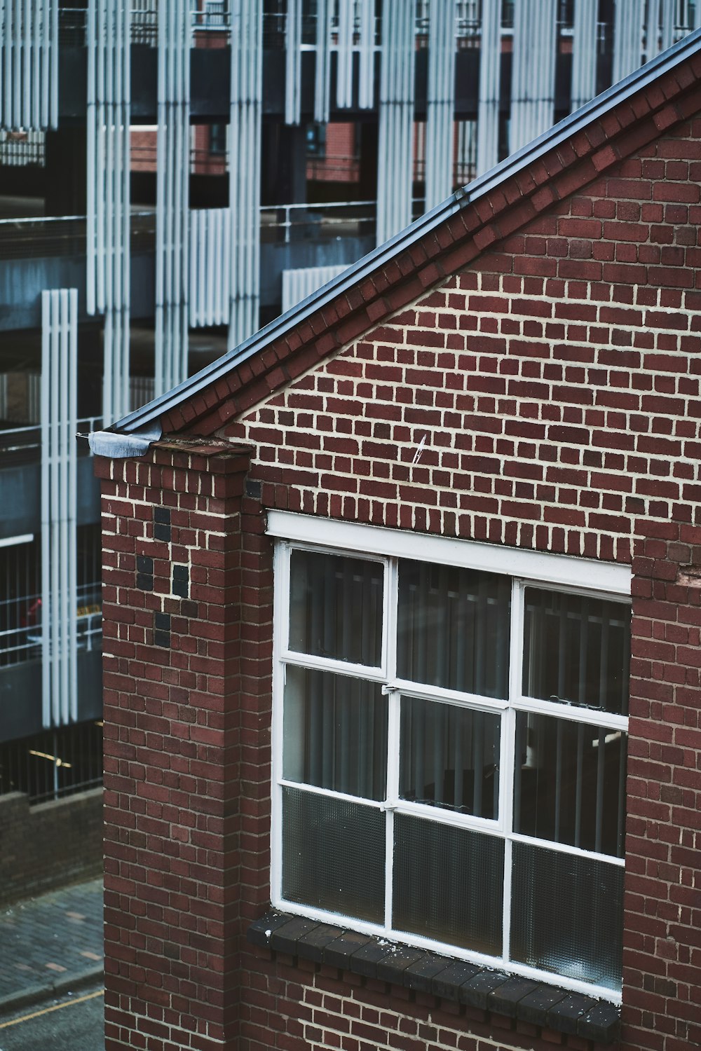 brown brick building with white window