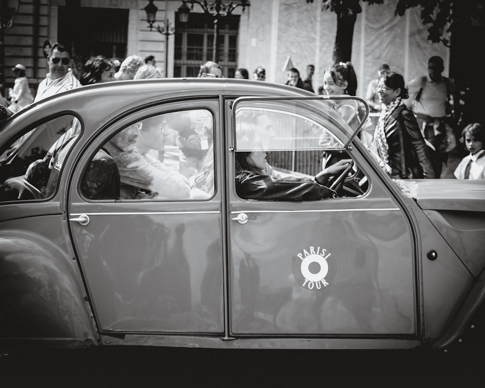 grayscale photo of car on street