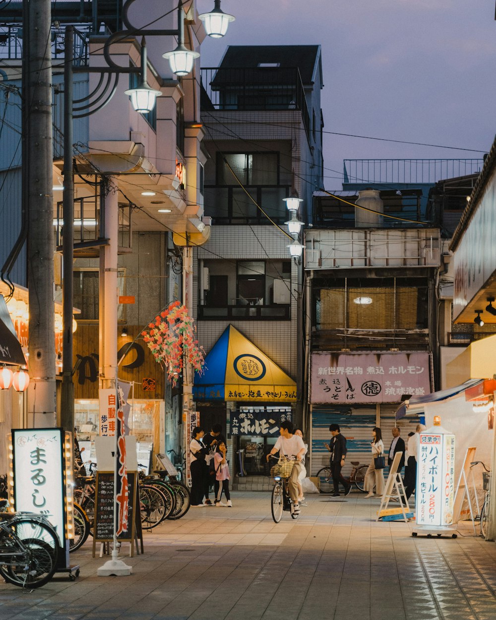 people walking on street during night time