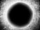 A circular black void at the center surrounded by a gradient of bright, speckled white and gray, which creates a halo effect. The overall texture is grainy and abstract, suggesting a cosmic or astronomical theme with a mysterious atmosphere.