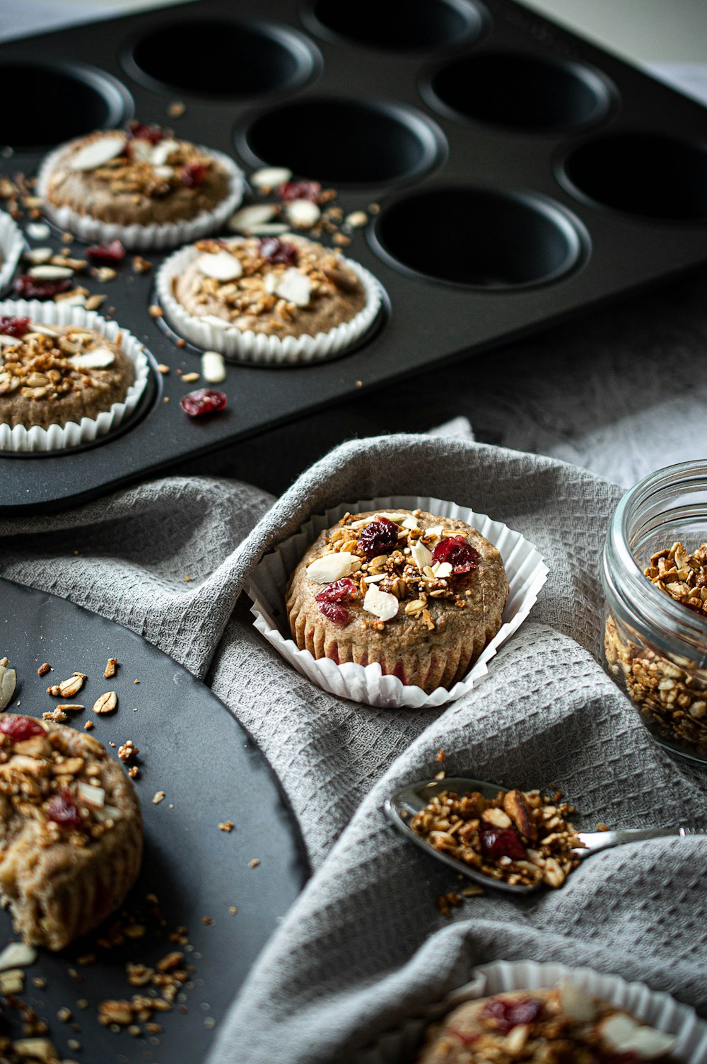 cupcakes on round tray beside clear glass bowls