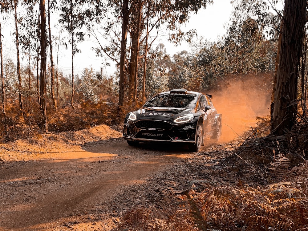 black chevrolet camaro on dirt road