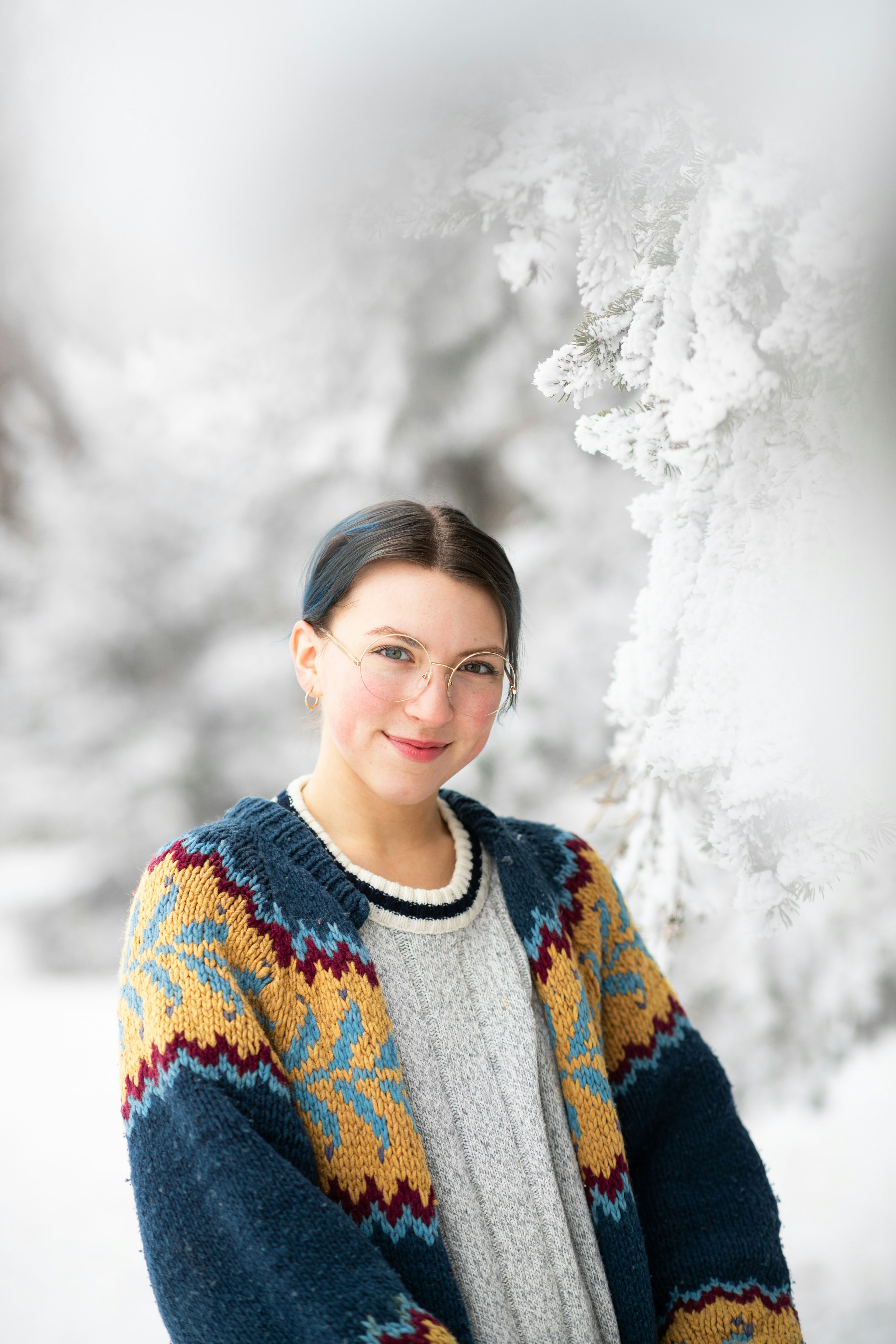 woman in blue and white sweater smiling