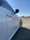 Image of a shiny, spotless car parked outside with a clear blue sky in the background.