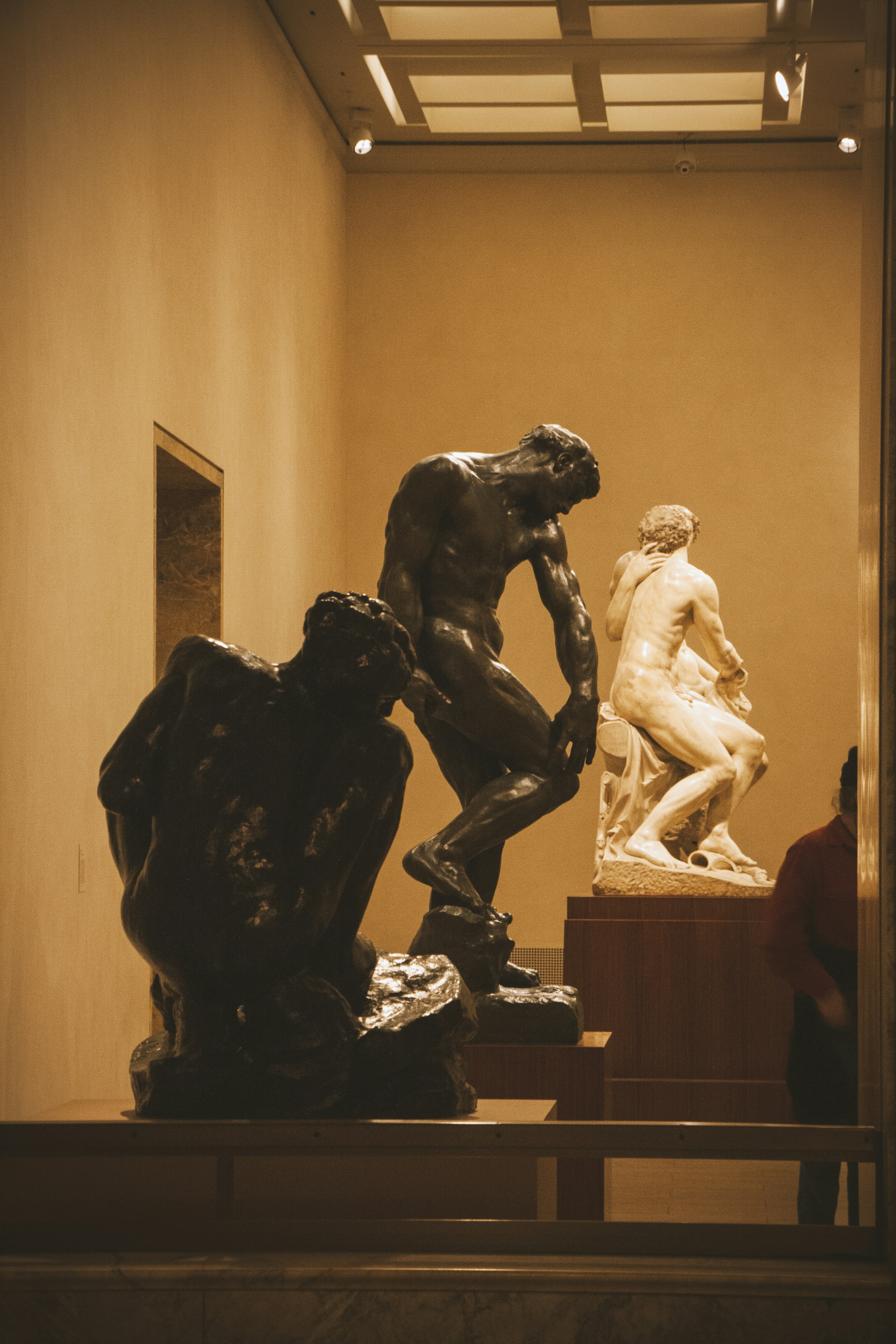 a statue of a man and a woman in a museum