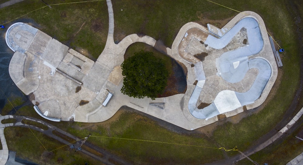 aerial view of green trees and gray concrete building