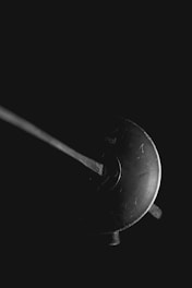 grayscale photo of a round coin