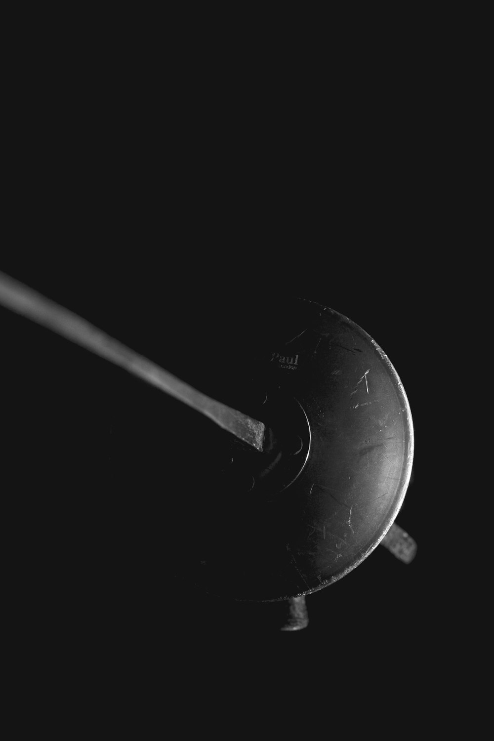 grayscale photo of a round coin