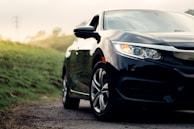 black mercedes benz c class on dirt road during daytime