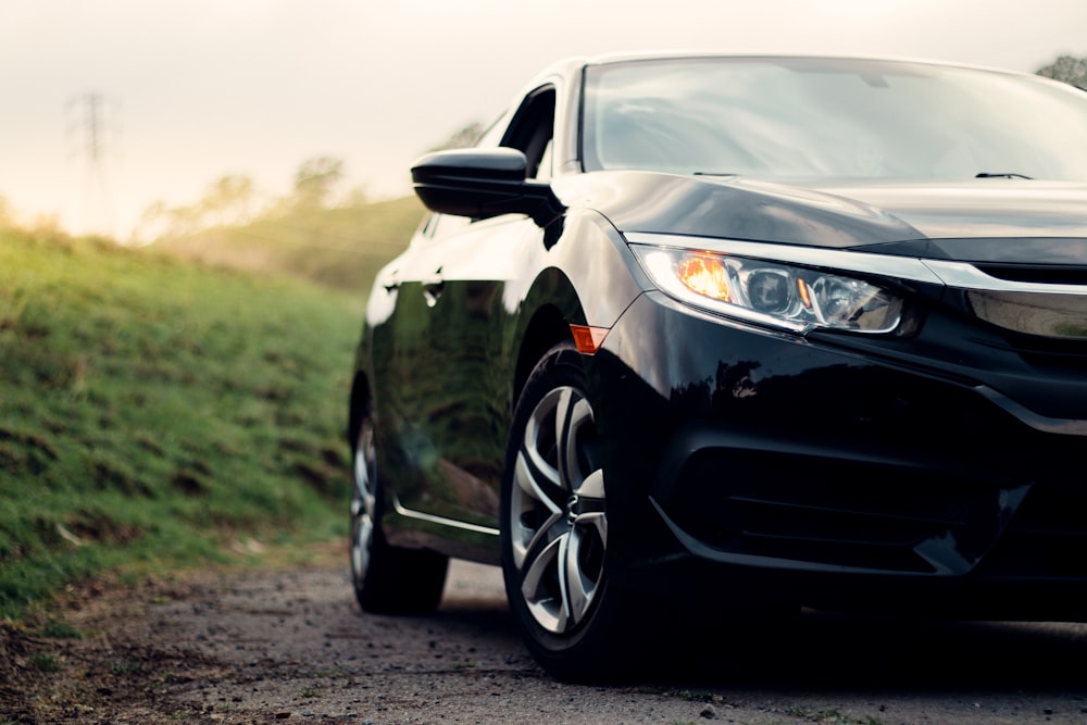 black mercedes benz c class on dirt road during daytime