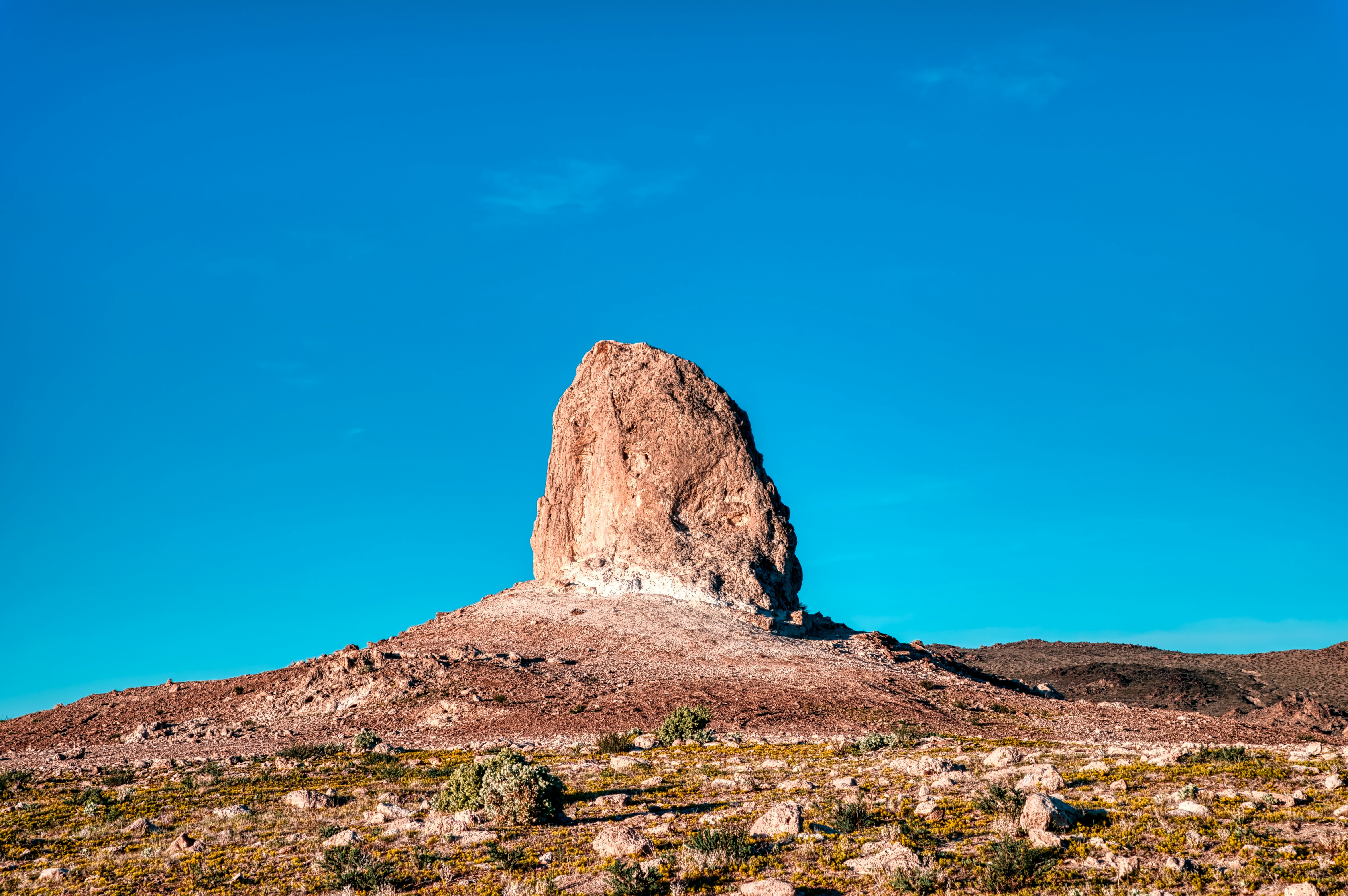 brown rock formation under blue sky during daytime