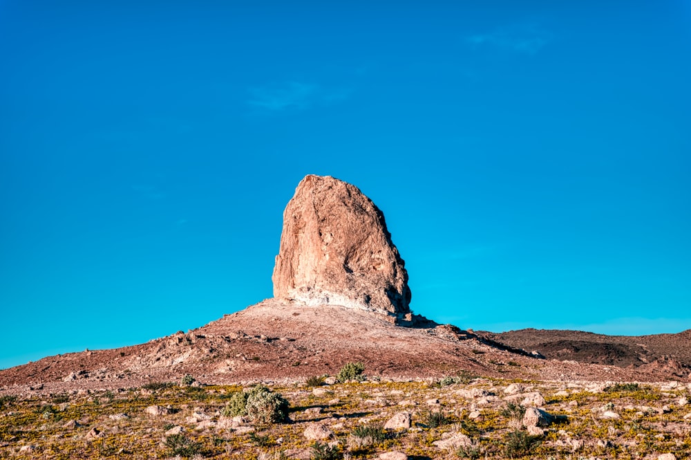 brown rock formation under blue sky during daytime