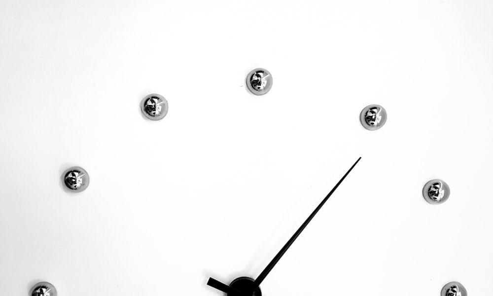 black round analog wall clock