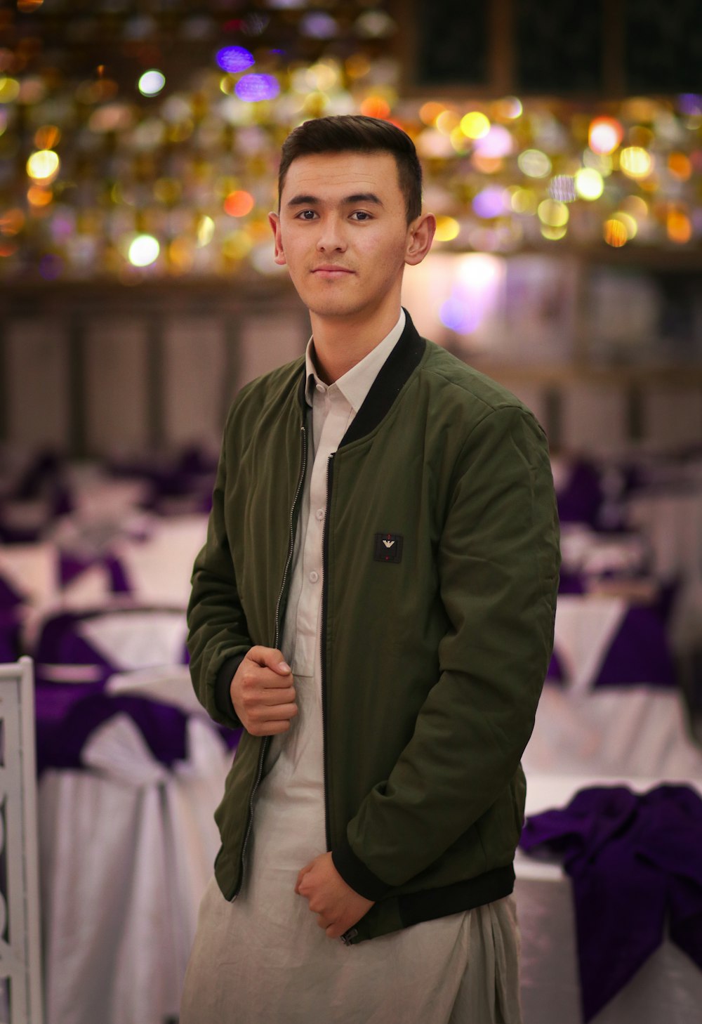 man in black suit jacket standing