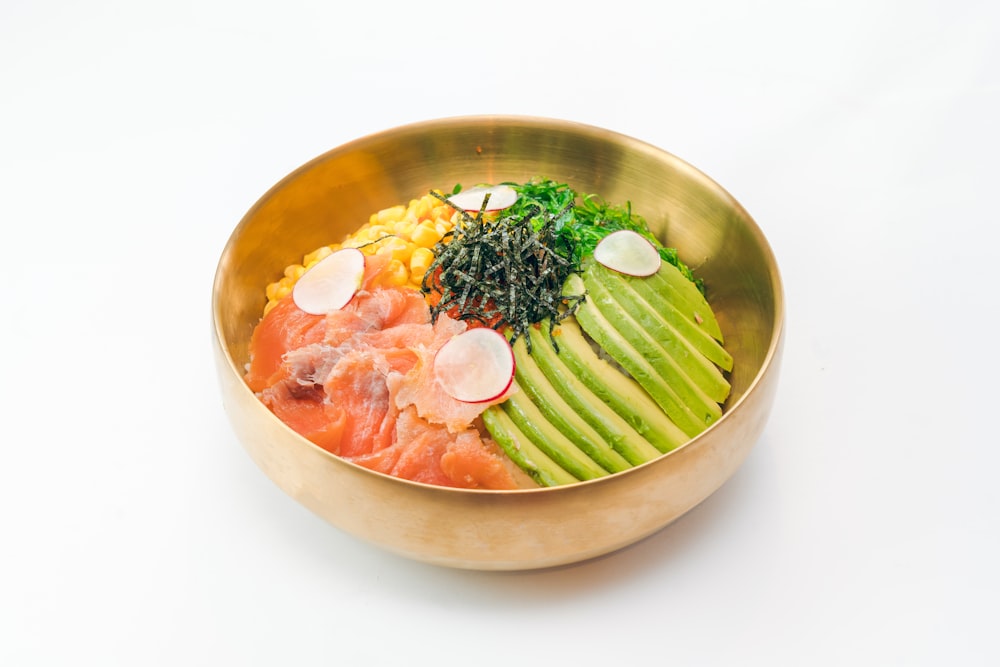 sliced meat with green vegetable in brown bowl