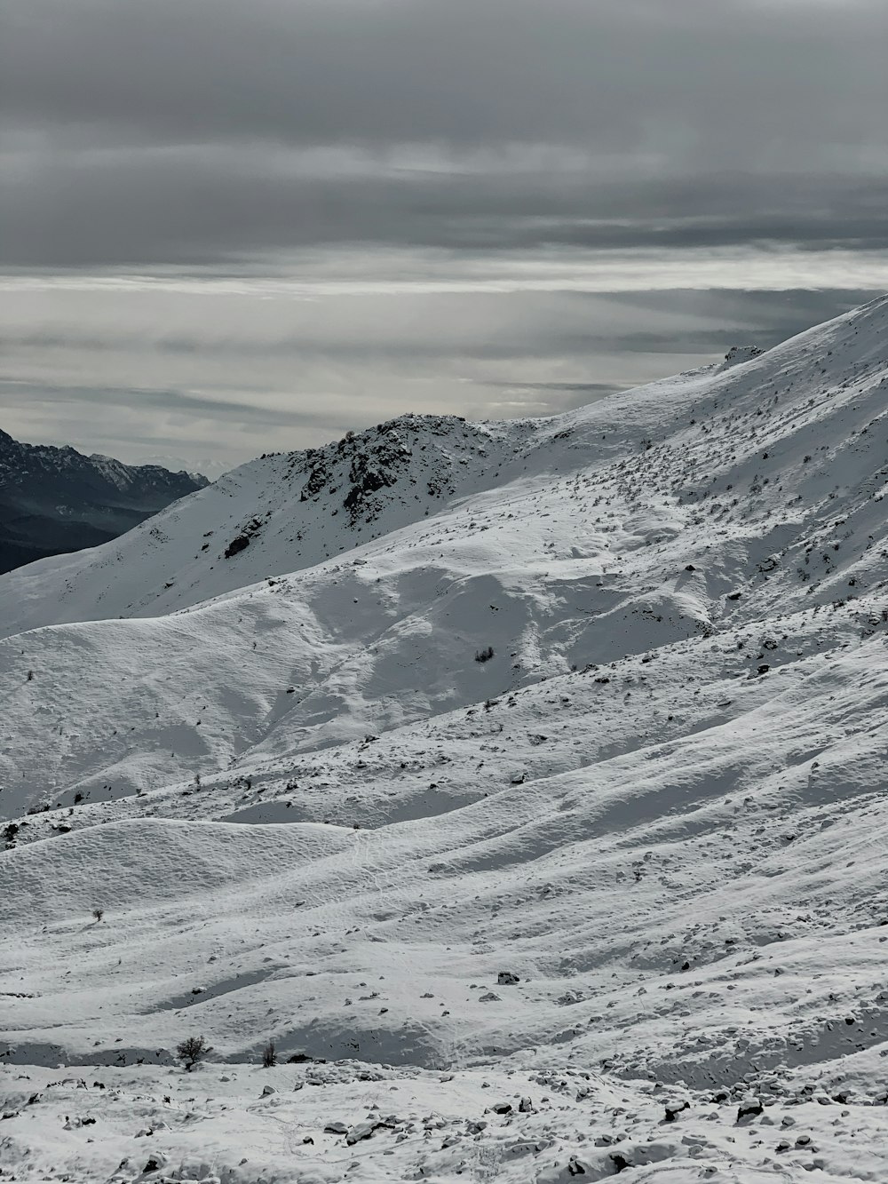 a man riding skis down a snow covered slope