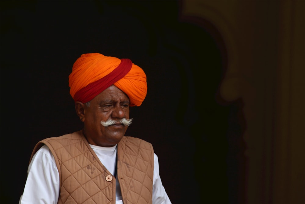 a man wearing a turban and a moustache