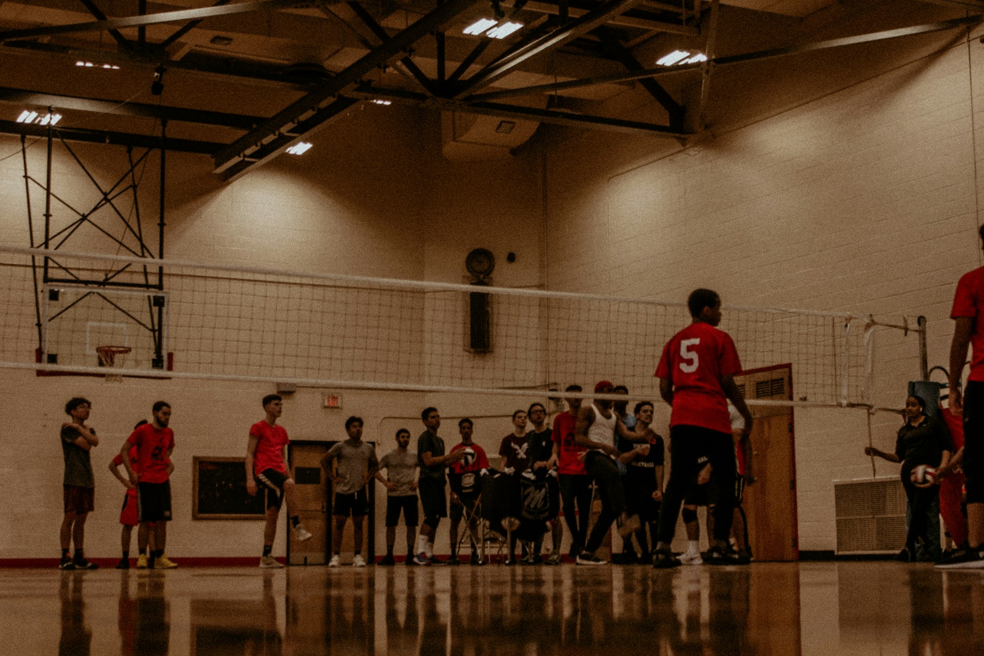 people playing basketball inside court