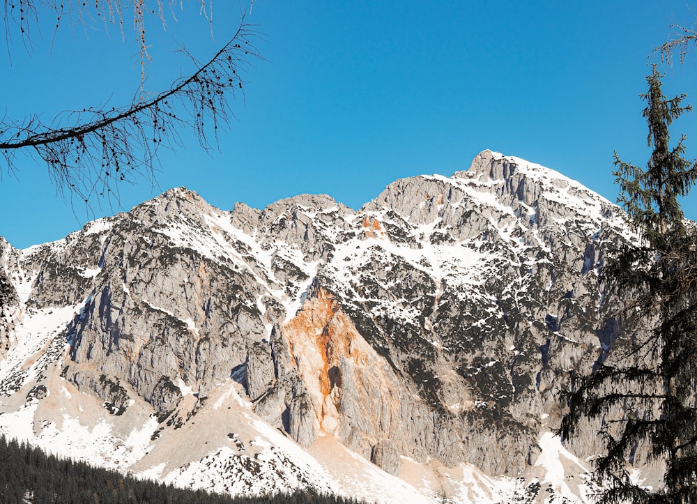 snow covered mountain under blue sky during daytime