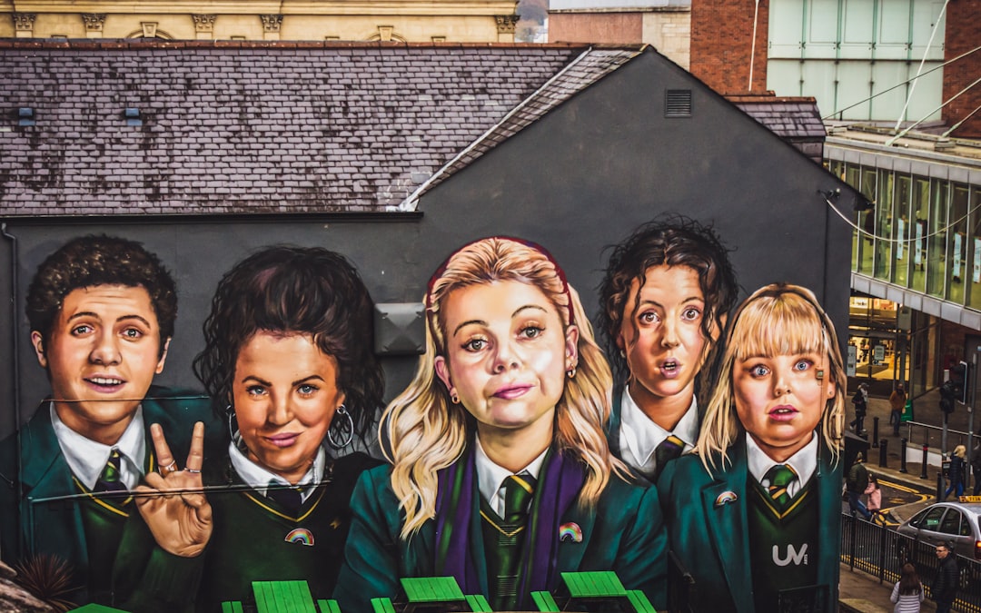 Mural of the Derry Girls from the popular TV comedy of the same name in the city centre shopping district near the Derry City Walls.