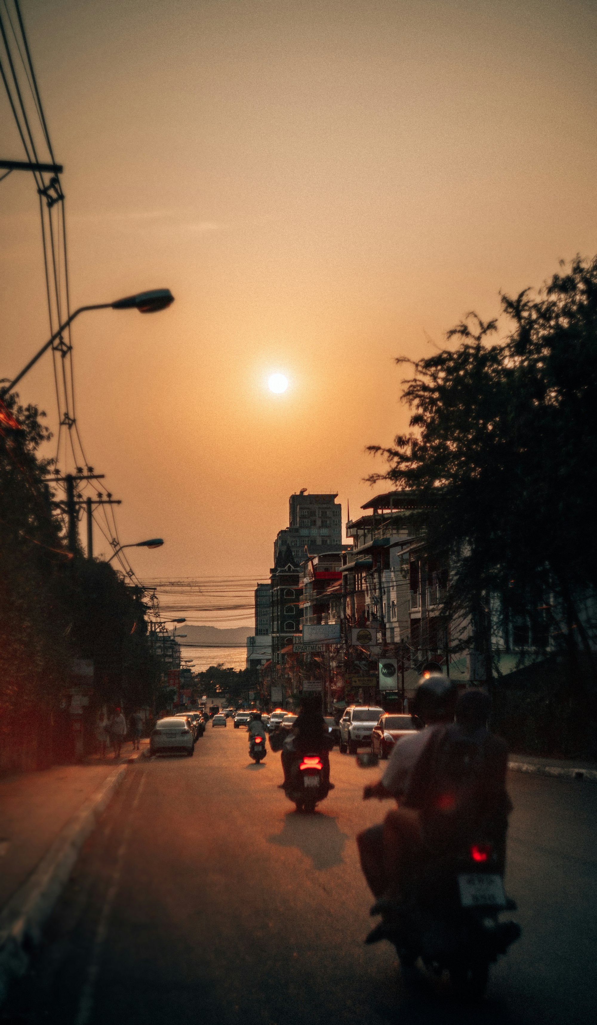 Thailand, Pattaya, road and motorbikes.