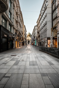 people walking on sidewalk between buildings during daytime