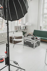 Interior video shoot setup showing a spacious living room with natural light.