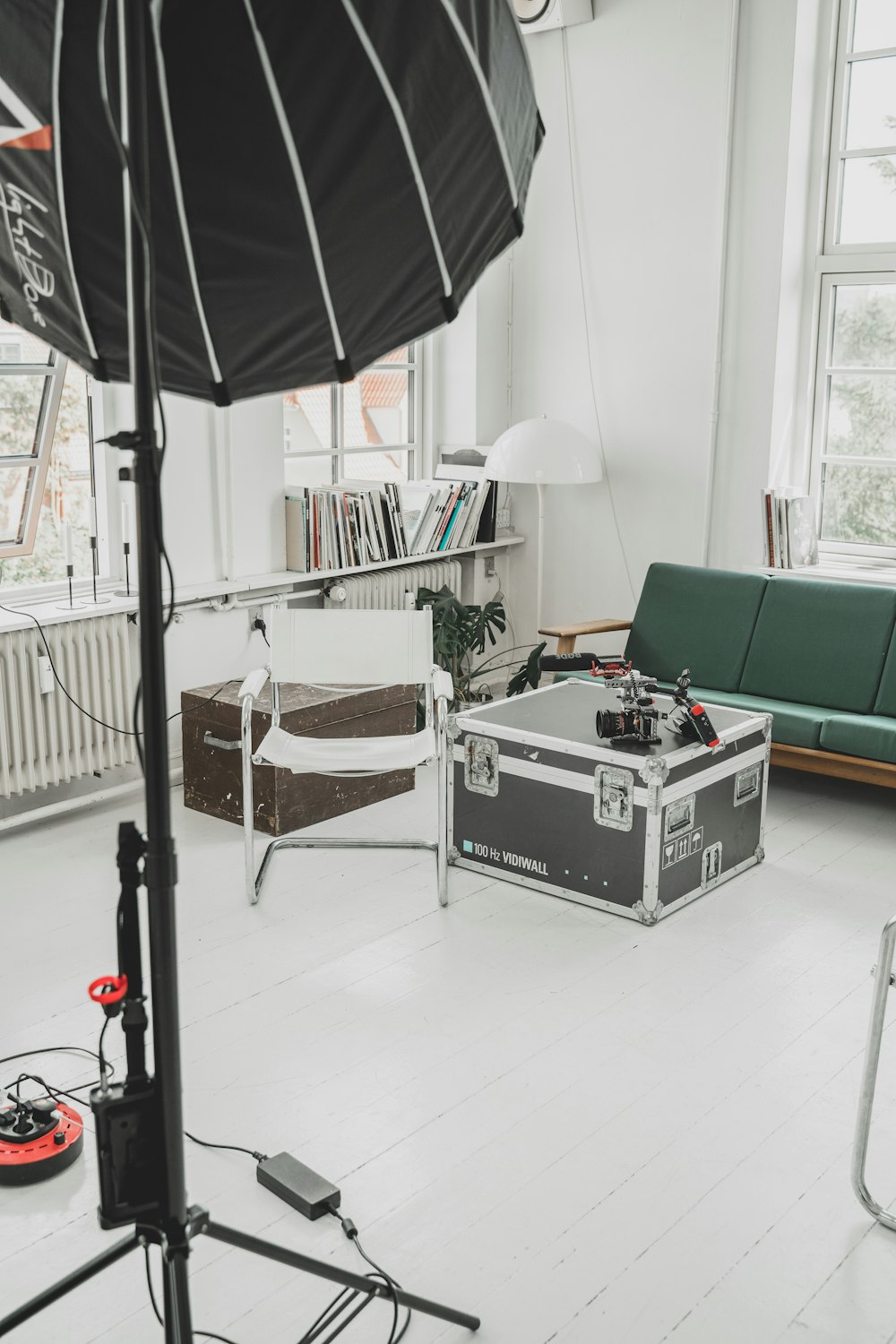 silver and black treadmill beside green couch