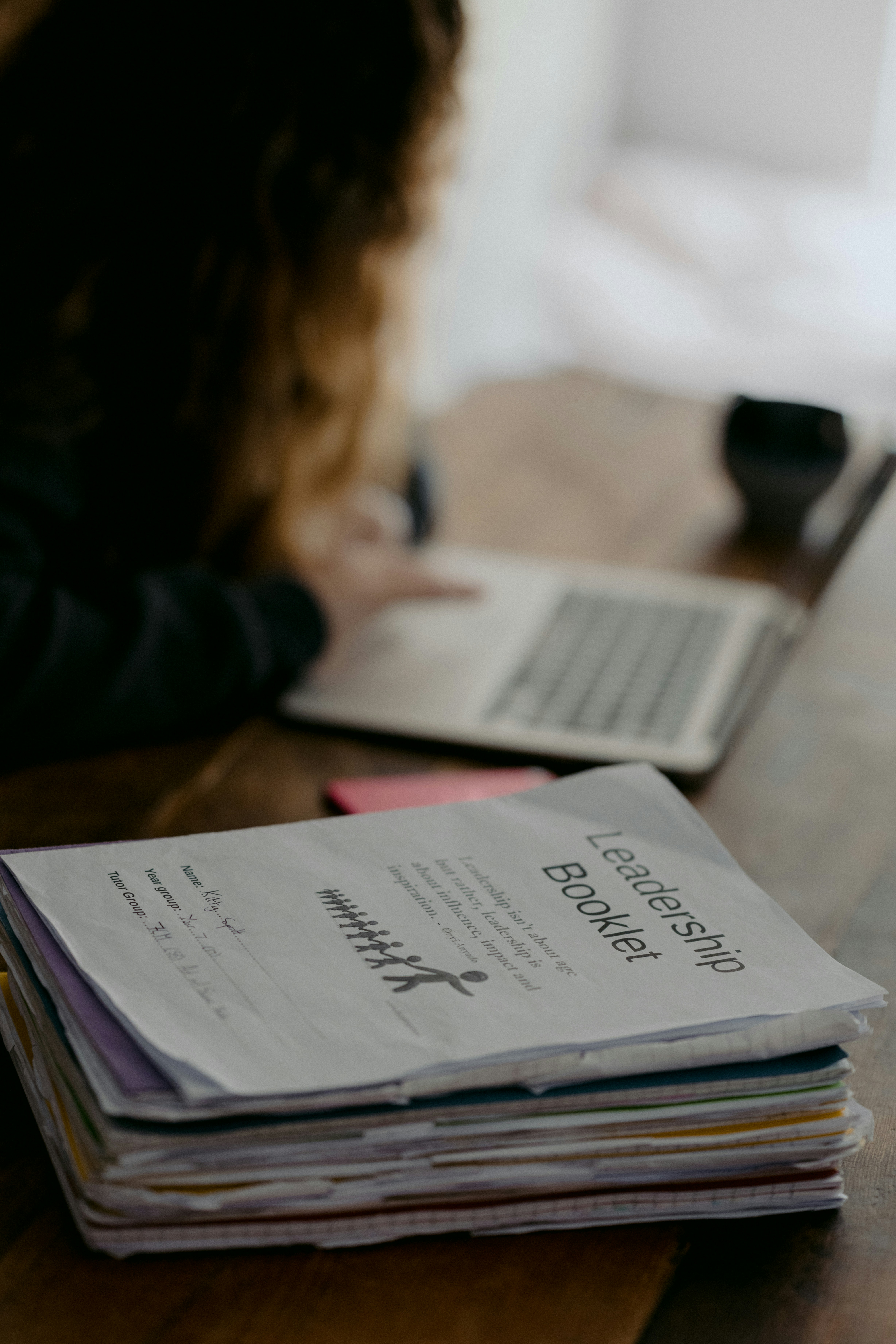 Young teen doing schoolwork at home after UK schools close due to the Coronavirus.