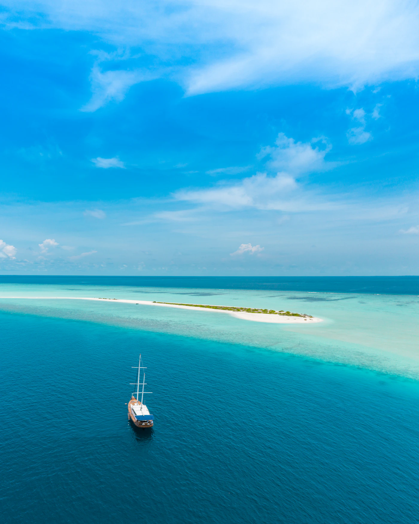 Work boat on bright blue water under a clear sky, representing the dive support vessel at the center of maritime legal claims