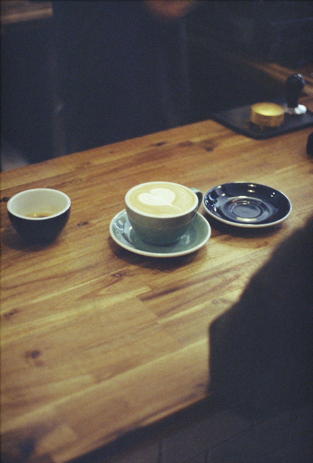 white ceramic bowls on brown wooden table