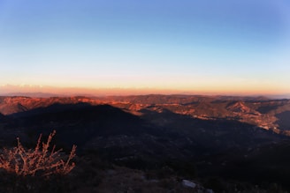 A panoramic view of the rugged Balochistan landscape at sunset.