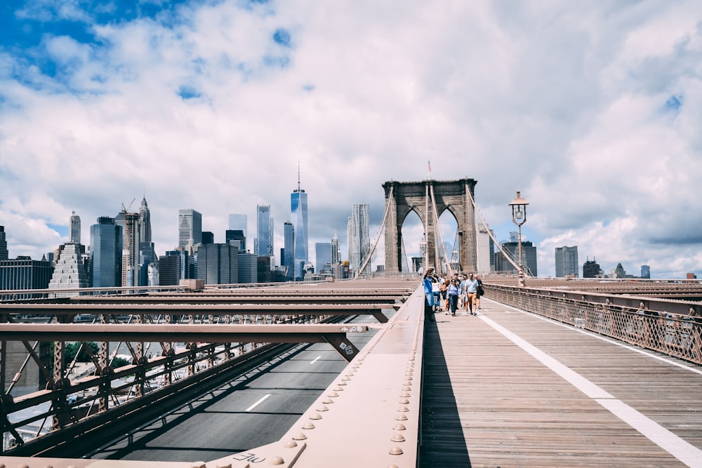 people walking on bridge during daytime