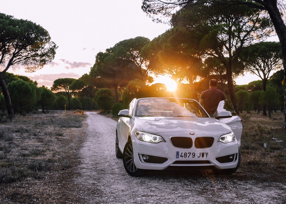 white bmw m 3 on road during daytime