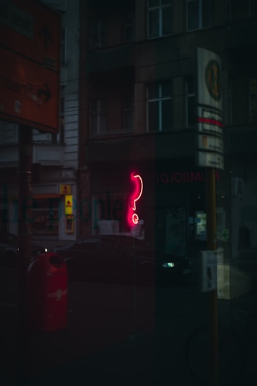 red and white open neon signage
