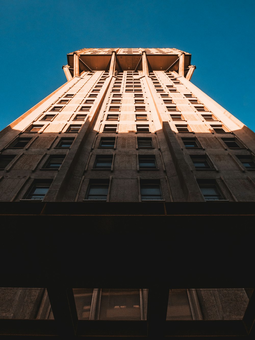 white concrete building under blue sky during daytime