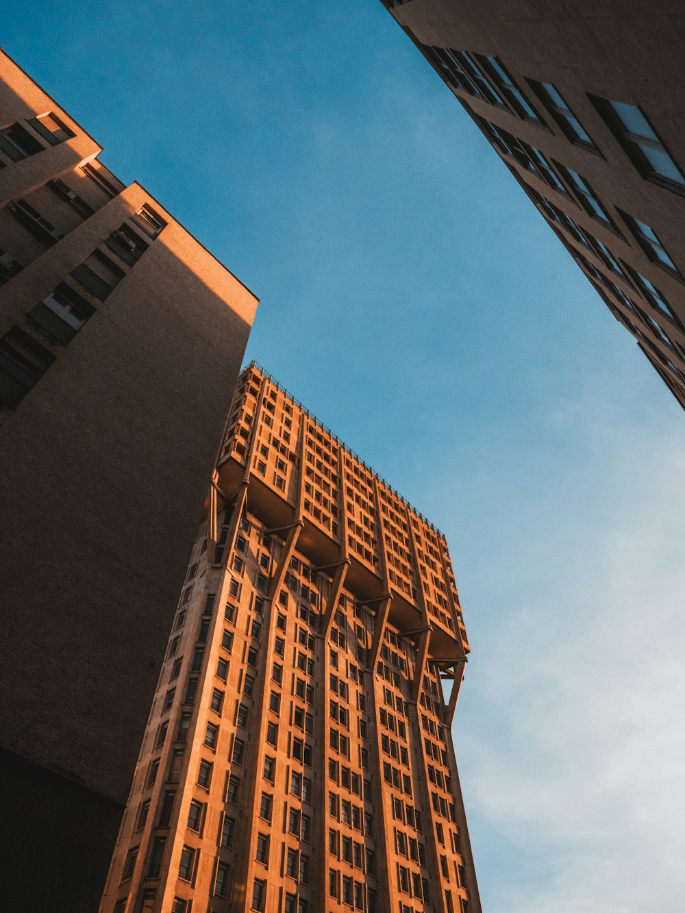 brown concrete building under blue sky during daytime